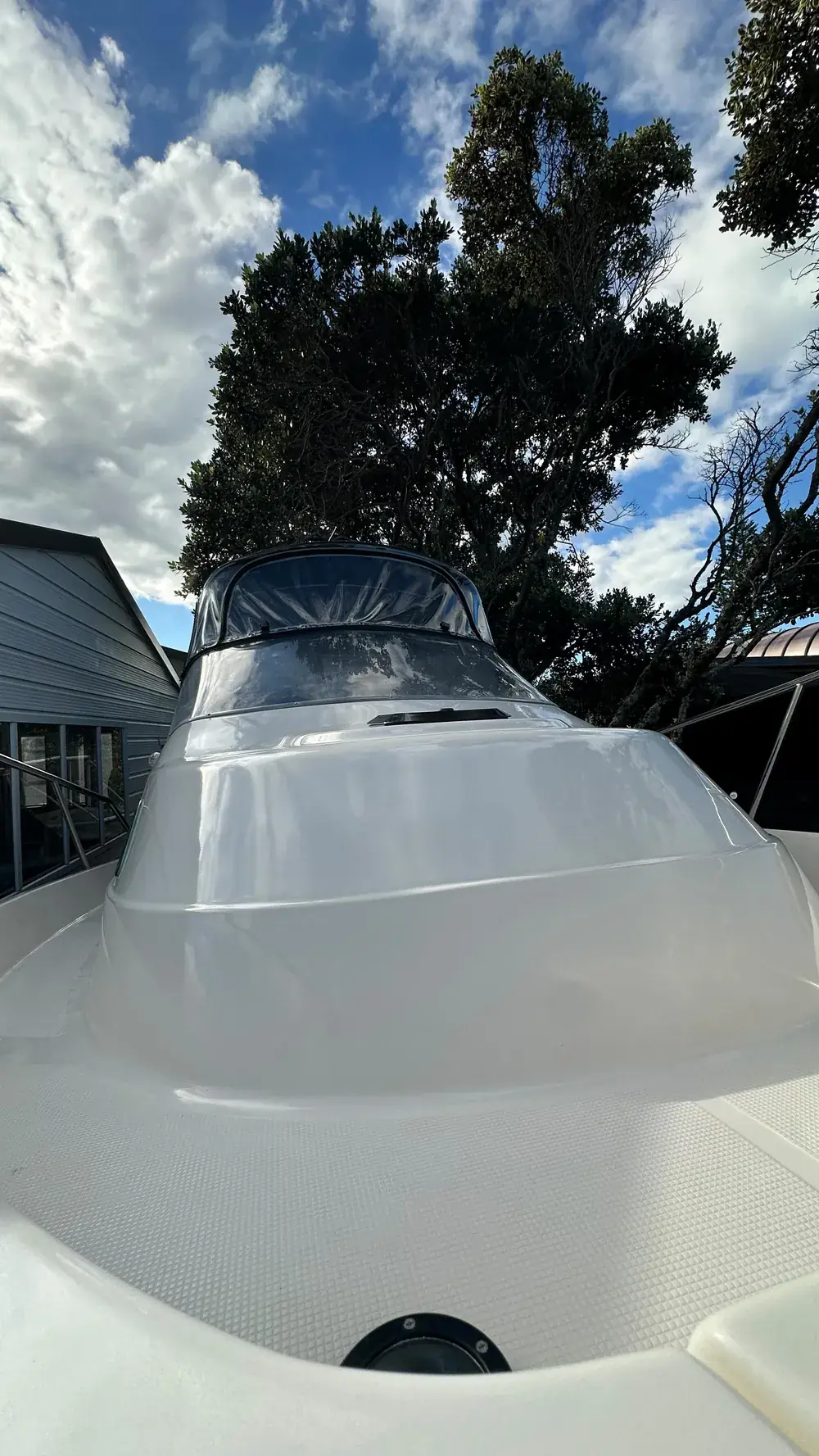 Polished boat bow with restored gelcoat gloss — Snells Beach boat detailing