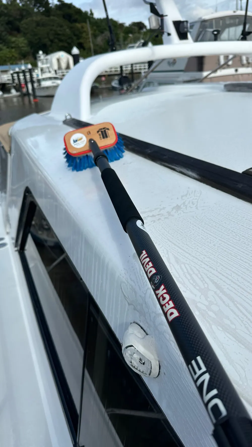 Hull Yeah Detailing at work — deck brush washdown on a boat, mobile service Rodney