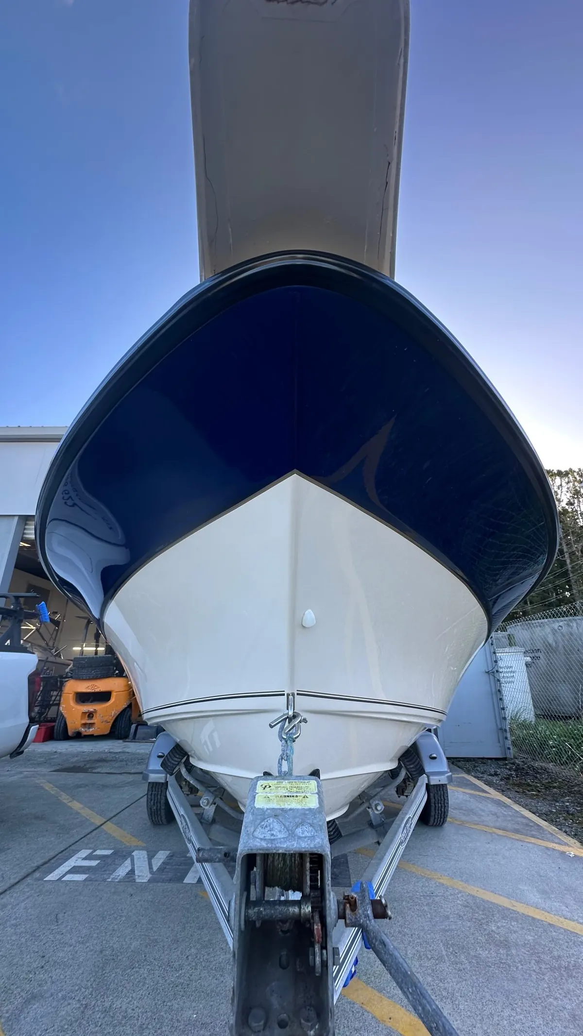 Deep navy boat hull polished to a deep gloss on trailer — Warkworth