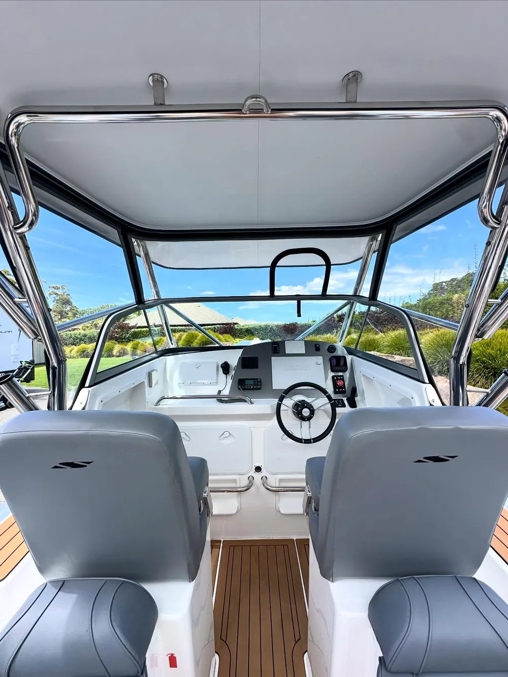 Boat helm and seating detailed — clean upholstery and brightwork