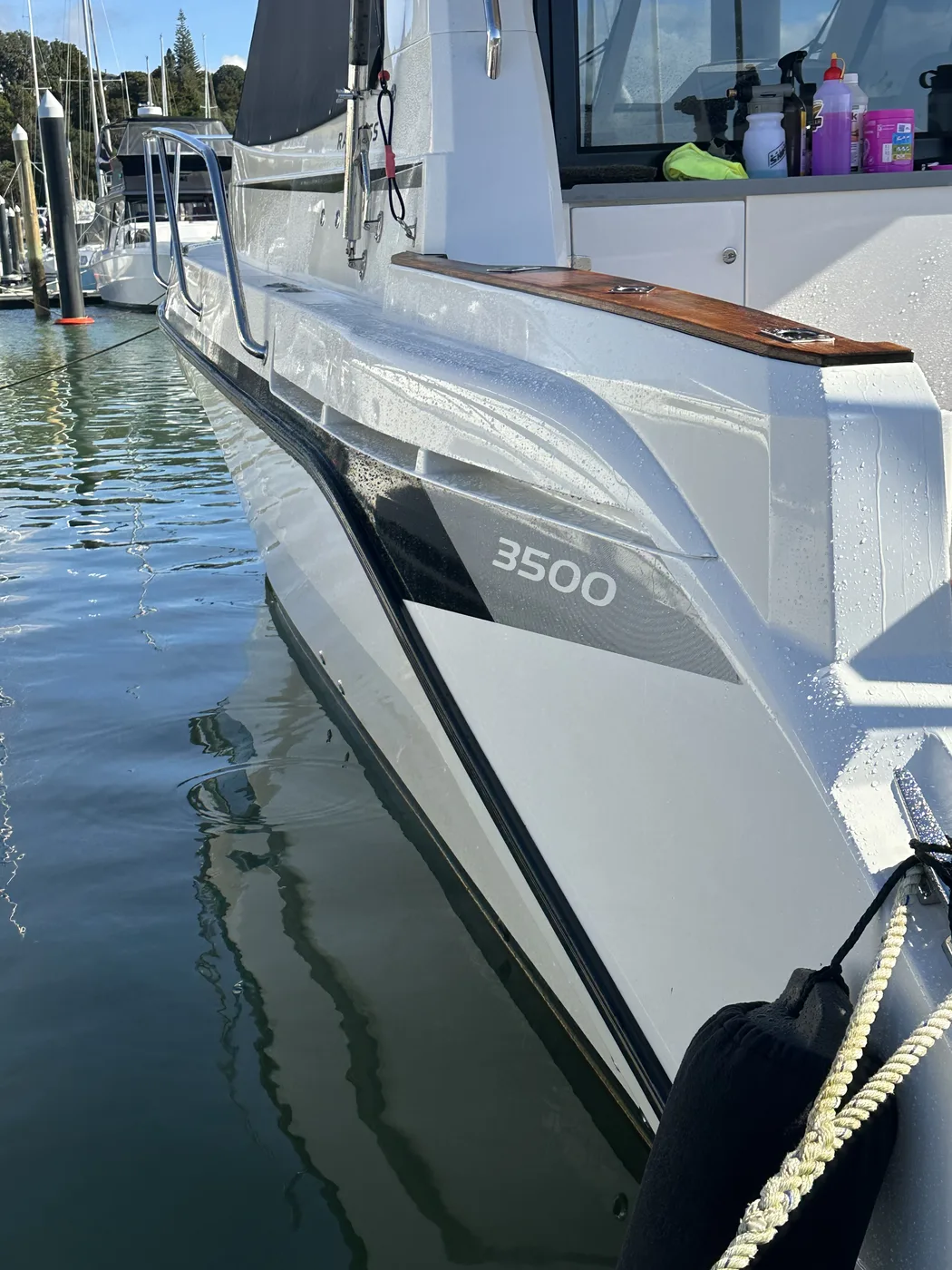 Rayglass 3500 hull side cut back to a deep mirror gloss with water beading — Hull Yeah Detailing